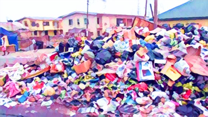 Overflowing garbage in a busy Nigerian street showing poor waste management